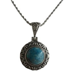 Silver necklace with blue/turquoise colored stone round pendant costume jewelry